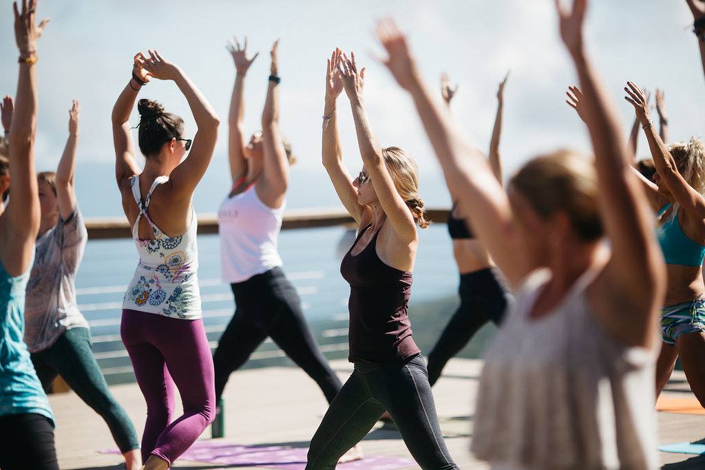 People practicing yoga at the 5506' SkyBar.