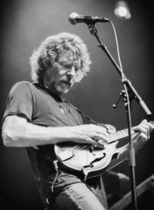 Sam Bush playing guitar